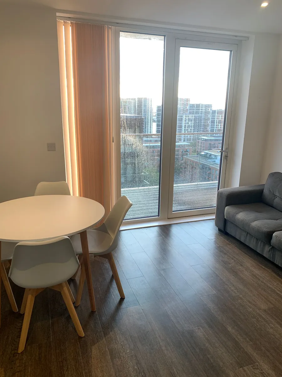 Clean dining area in a London flat with balcony
