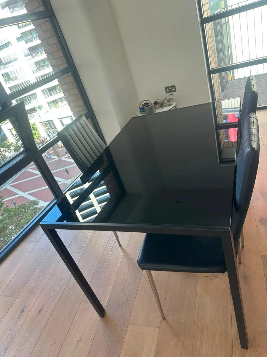 Clean table and chairs by a window in a London property