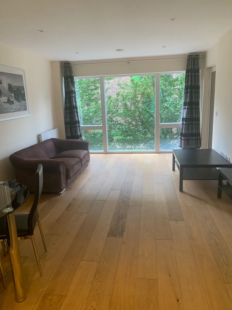Clean London living room with polished oak floor